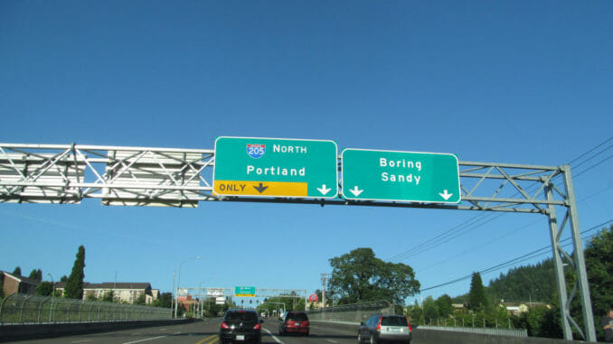 Road signs above an Oregon highway